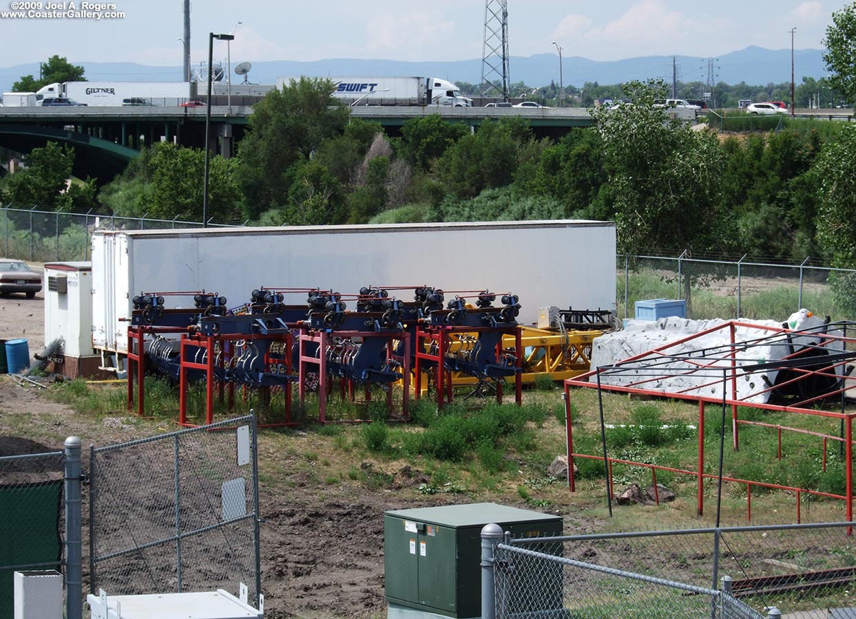 Roller coaster cars sitting in junk yard