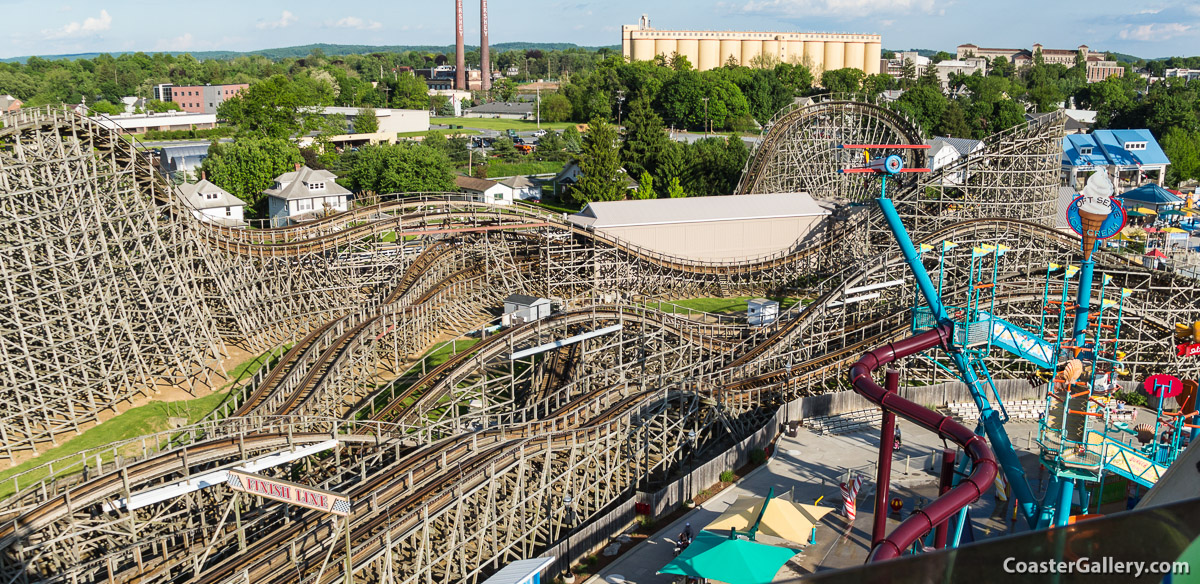 Thunder and Lightning trains on the Hersheypark roller coaster. In the background is the Hershey chocolate factory.