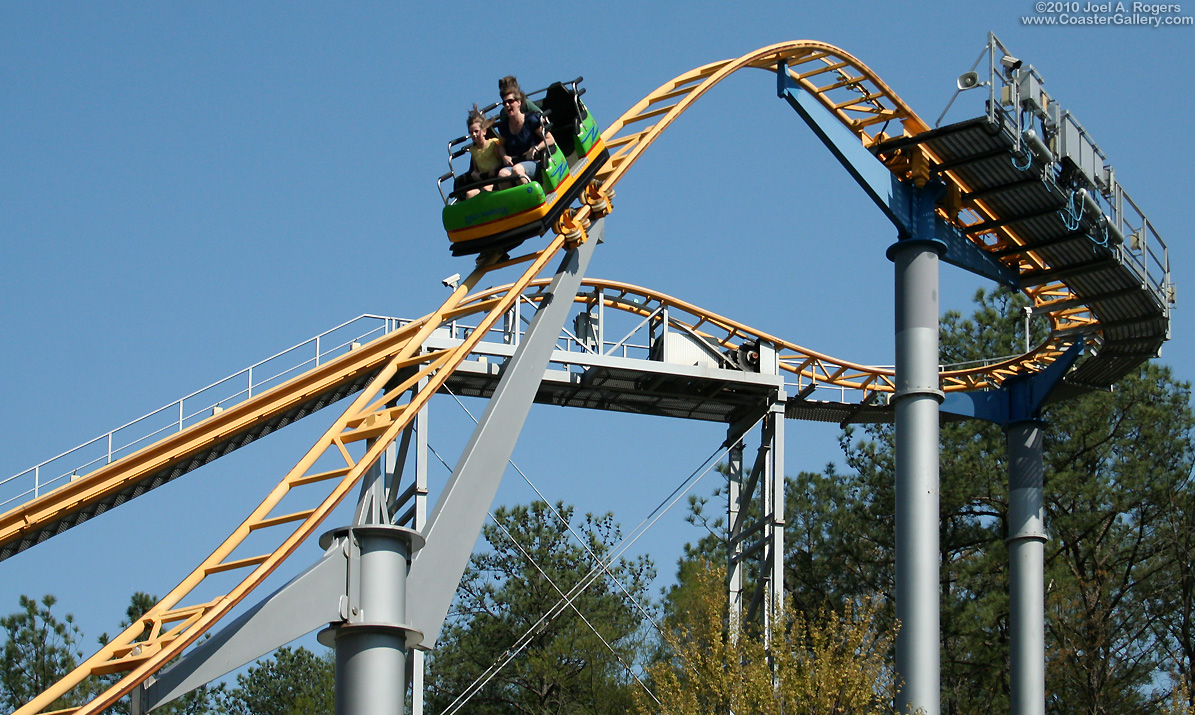 Four-passenger car going over the first hill