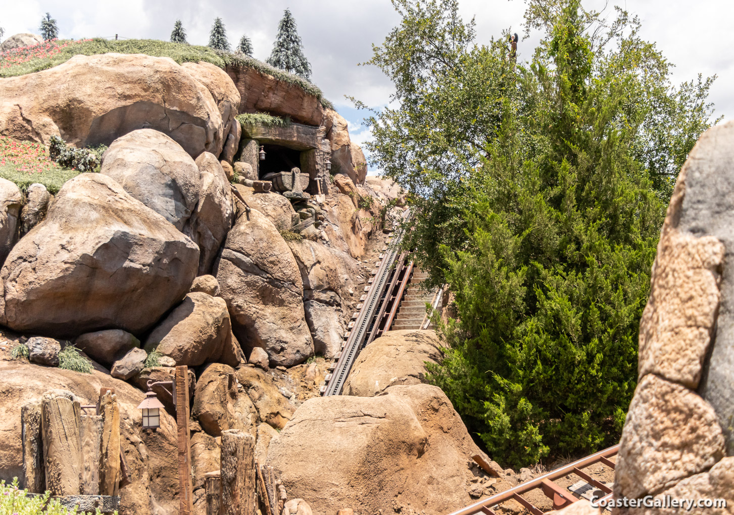 The man-made terrain, fake rocks, and artificial tress on the Seven Dwarfs Mine Train