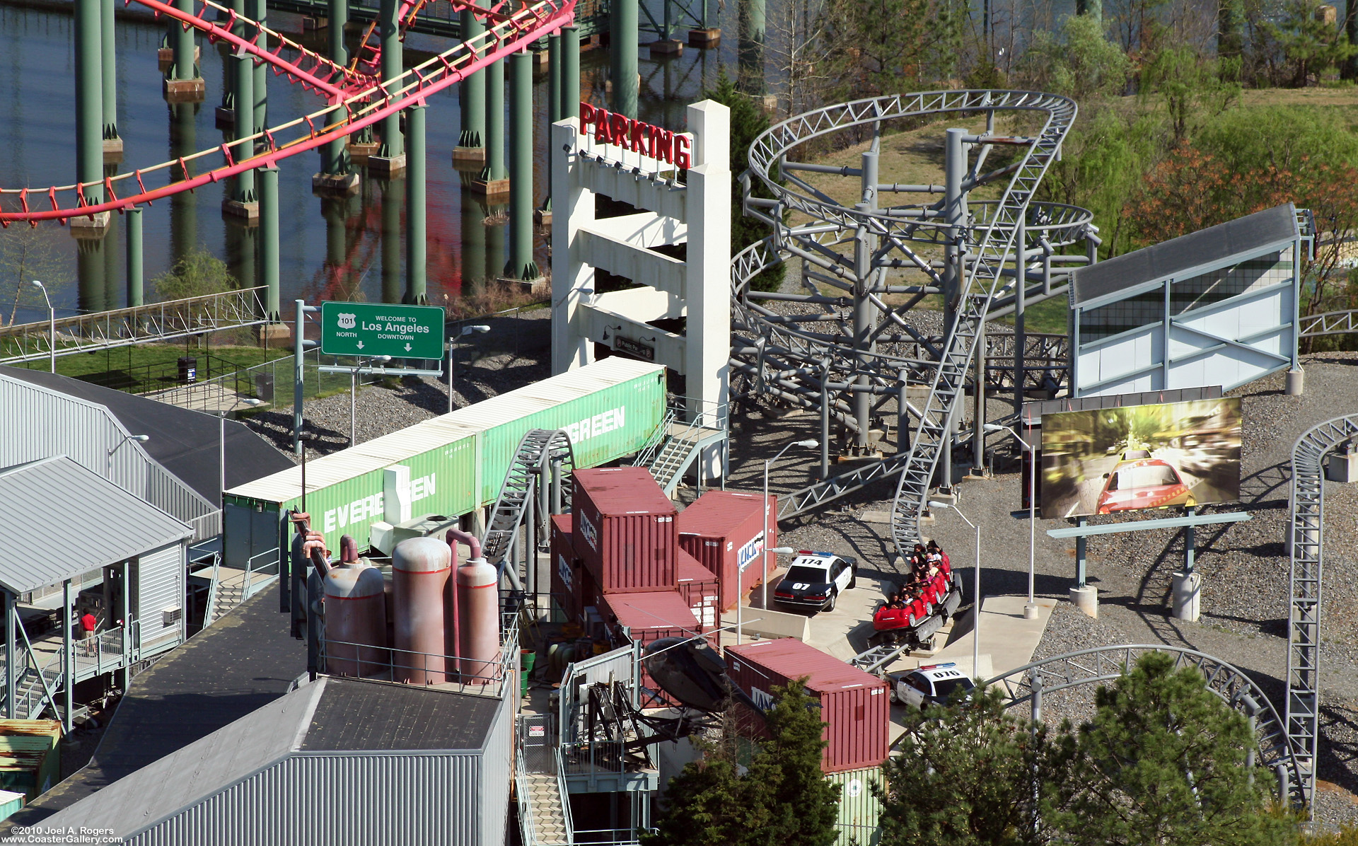 Aerial view of police cars and a helicopter. Linear Induction Motors are used on this roller coaster.