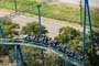Aerial view of a blue and green roller coaster