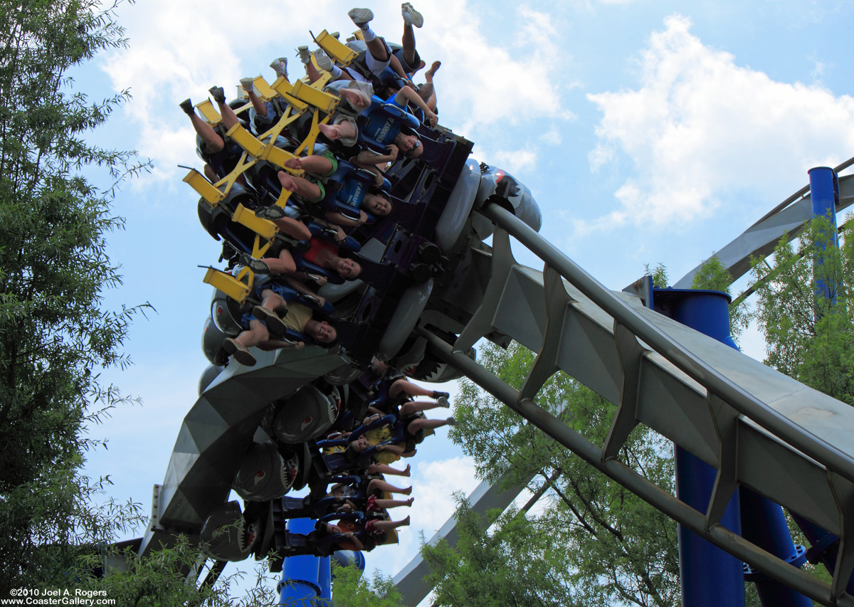 Stock image of an inverted roller coaster going upside down