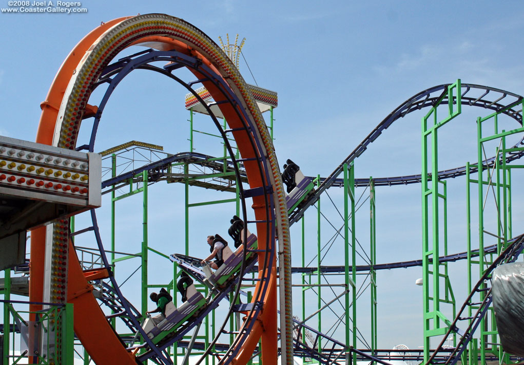 A steel roller coaster diving down the hill