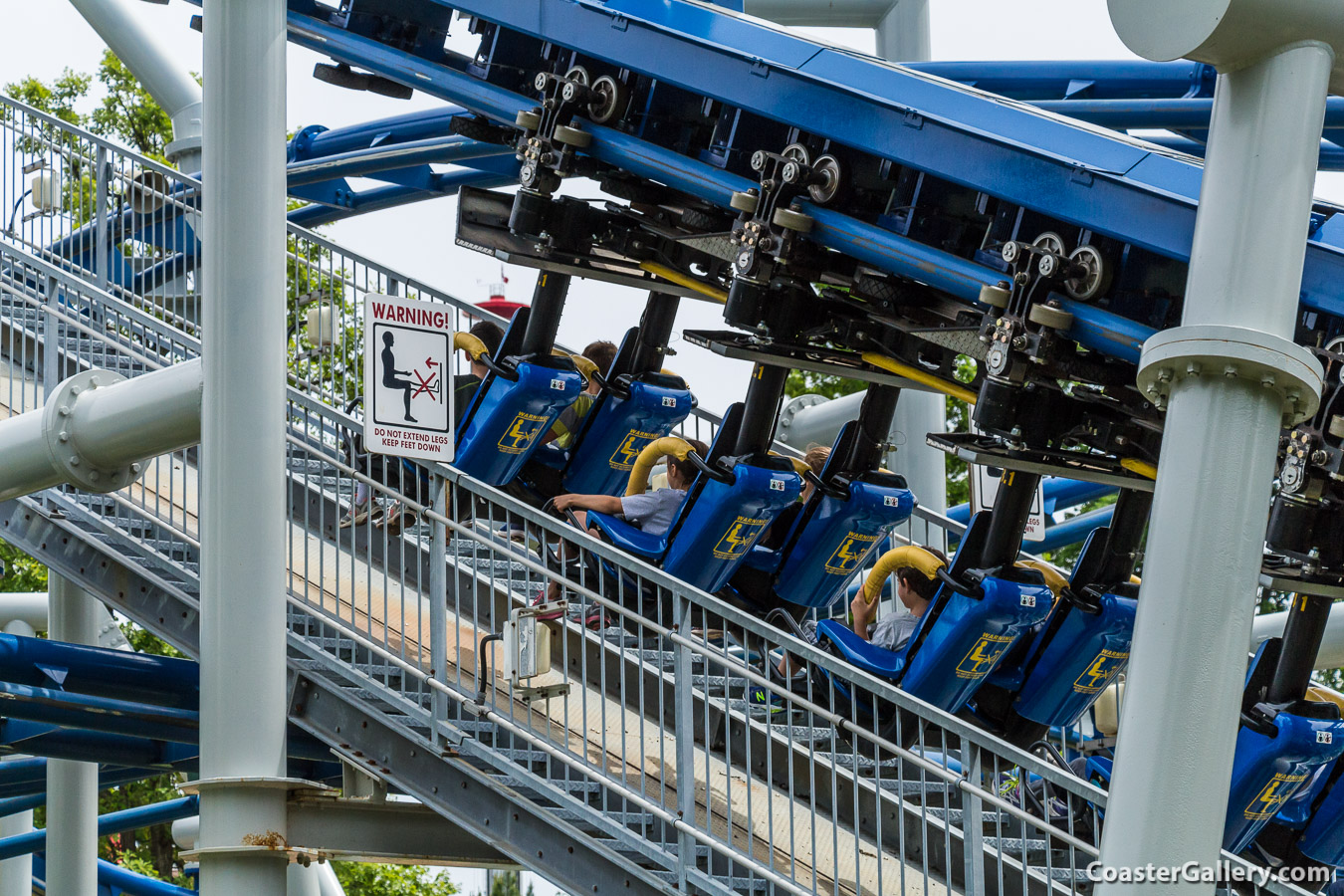 Warning signs to prevent injuries on inverted roller coasters