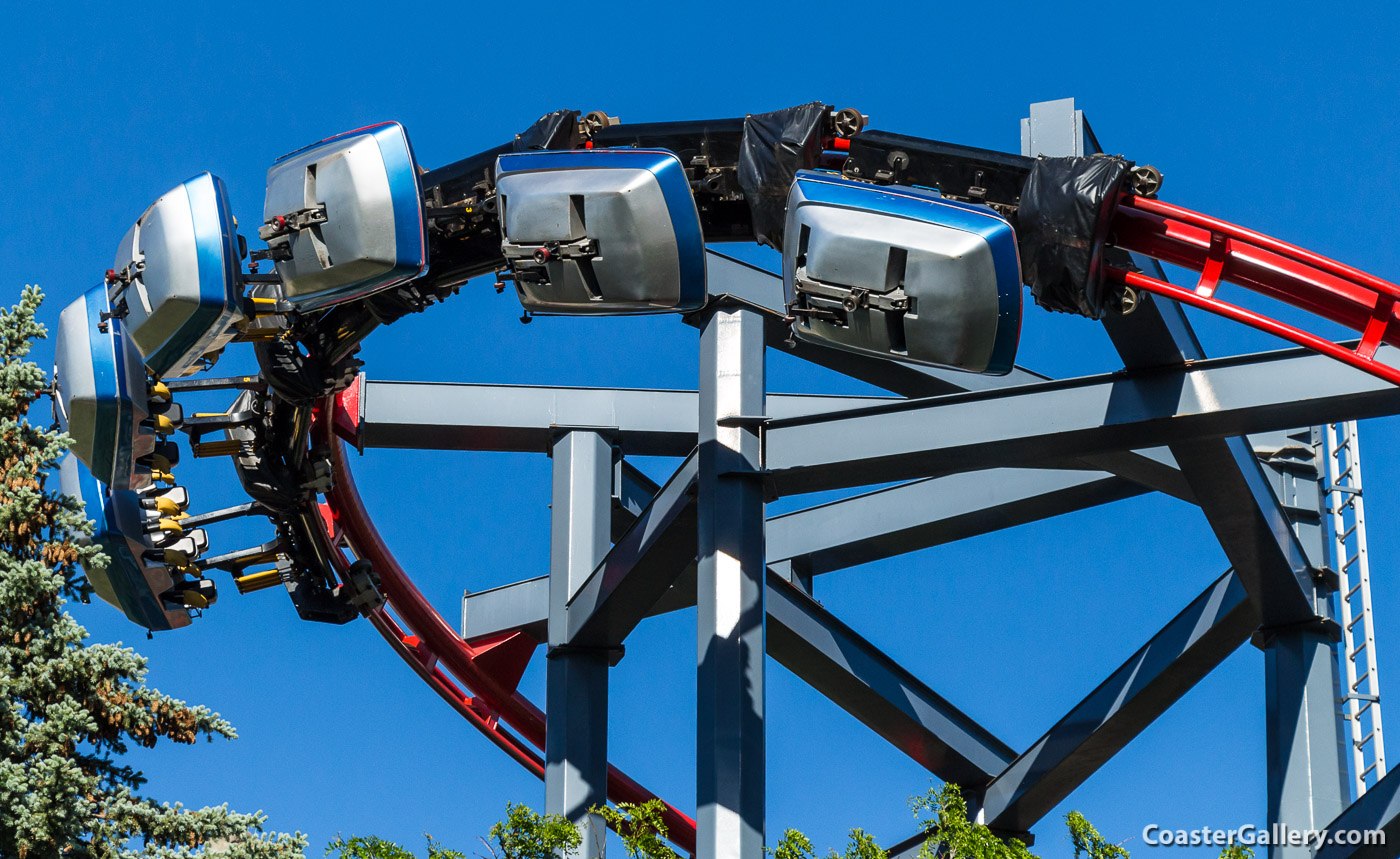 Details of a roller coaster train and safety restraint systems
