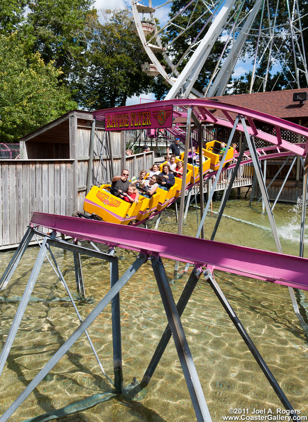 Roller coaster passing over the water