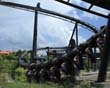 An inverted roller coaster coming very close to the ground