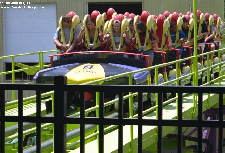 Stand-up roller coaster full of glad riders.
