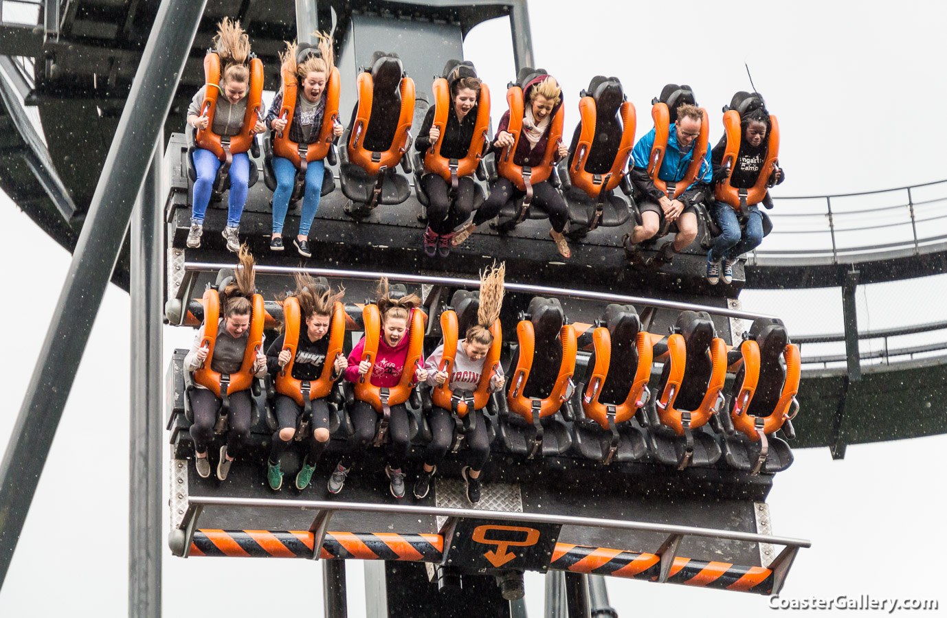People riding Oblivion in the rain