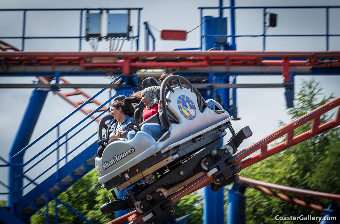 People riding the Sonic Spinball roller coaster at Alton Towers