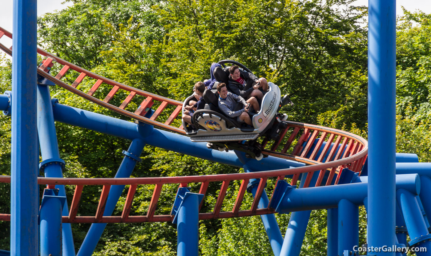 People having fun on a spinning roller coaster in England